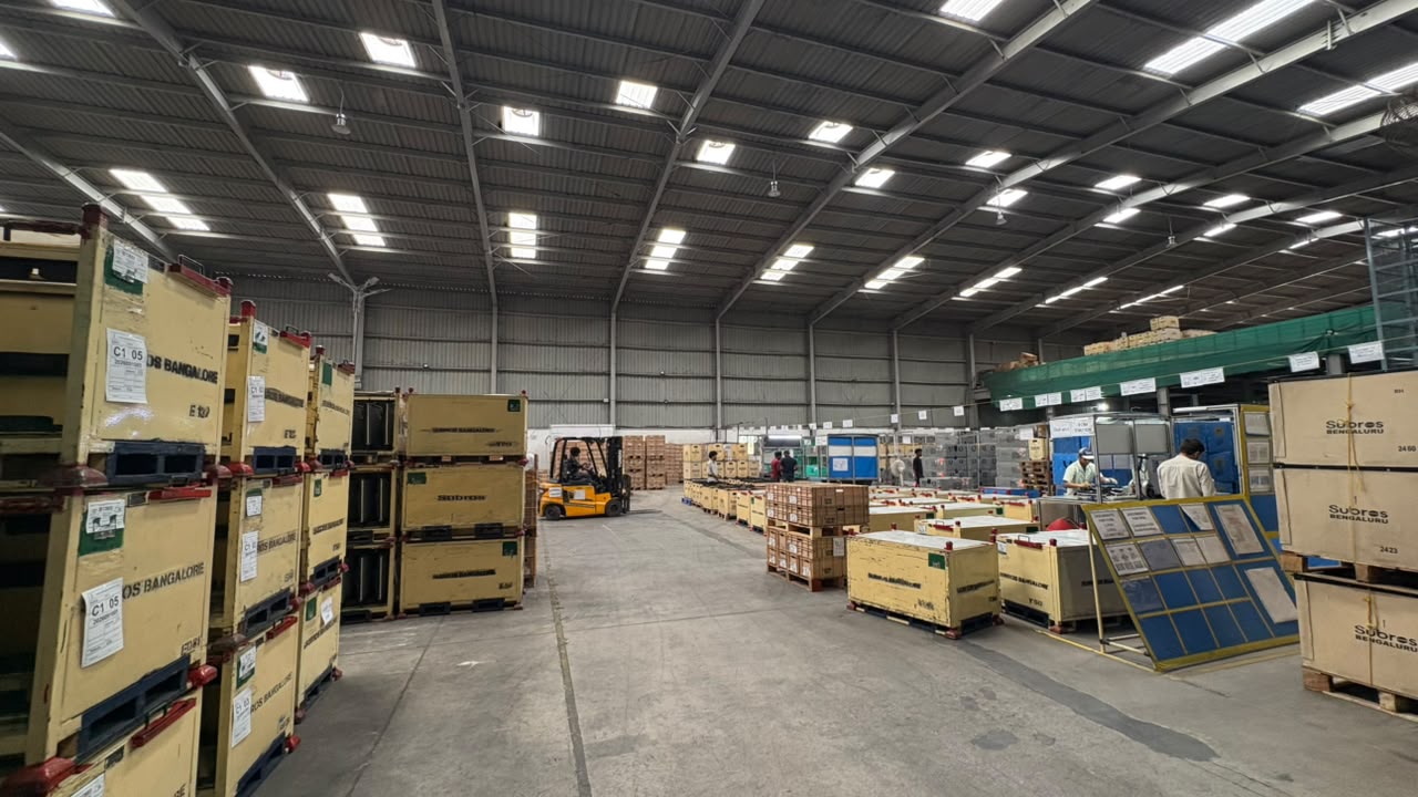 Original PCL warehouse photograph showing storage aisles, automotive containers and material handling